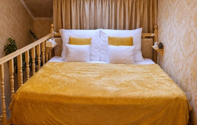 Interior of Jázmin Apartment micro loft studio in Debrecen city center showing king bed 200 x 200 cm